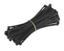 Bundle of black acid-resistant cable ties stacked together
