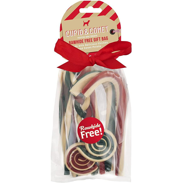 Packaging of Cupid & Comet rawhide-free dog treats, featuring a clear plastic bag with a red ribbon bow, and a label that reads 'Rawhide Free!' with a Christmas-themed graphic design.