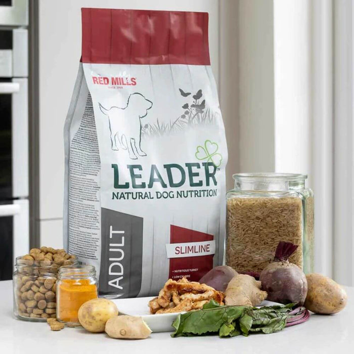 Red Mills Leader natural dog nutrition package with ingredients on a kitchen counter