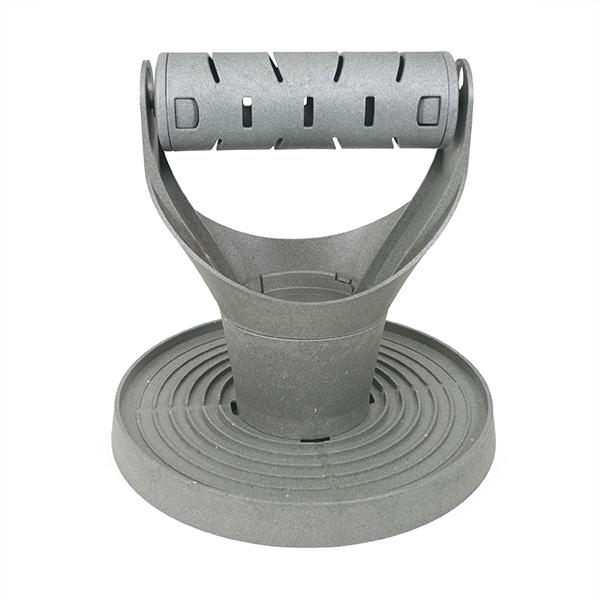 Grey treat dispenser for chickens.