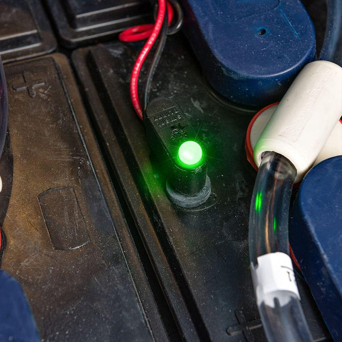 Battery watering monitor installed with bright green LED indicator light